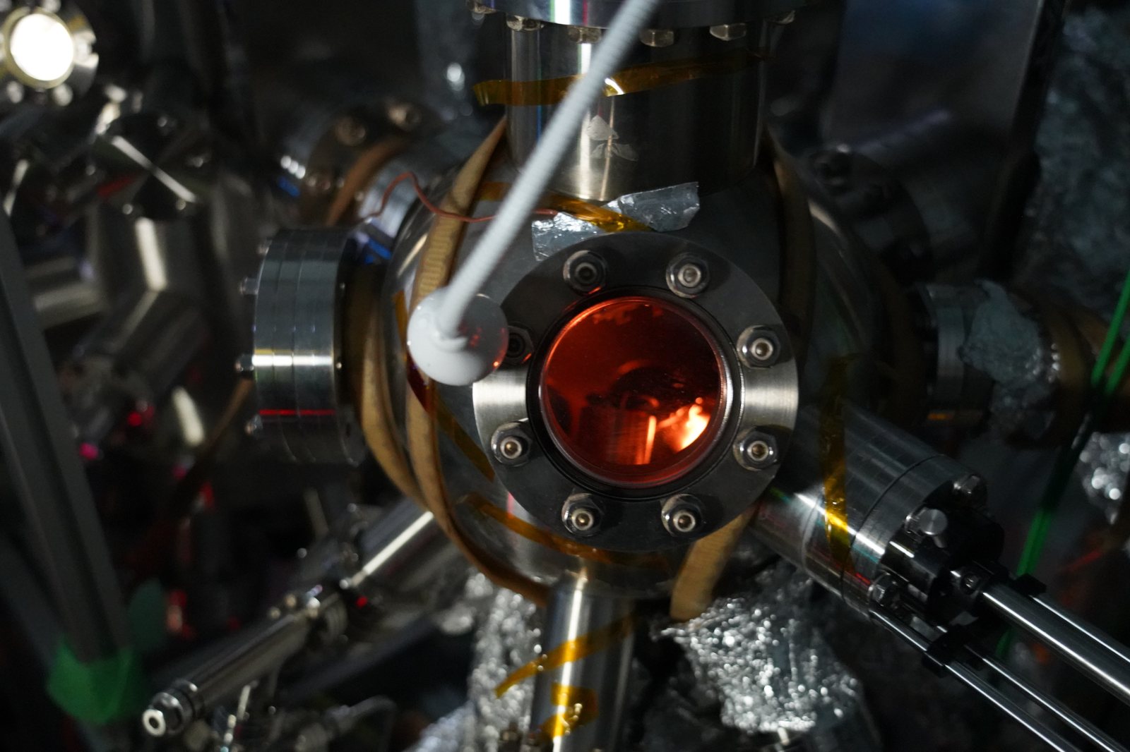 View into a CBN Nano vacuum chamber through an illuminated viewport